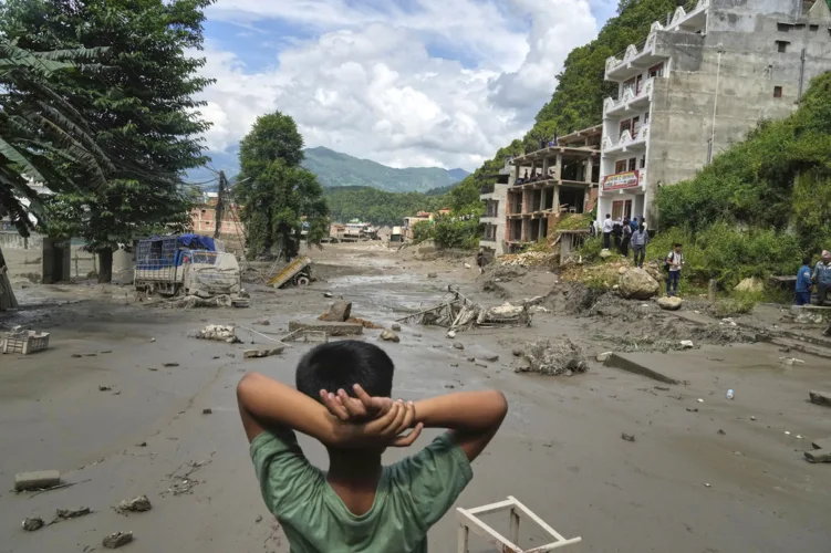 At least 160 killed and hundreds missing after flash floods in Nepal and China